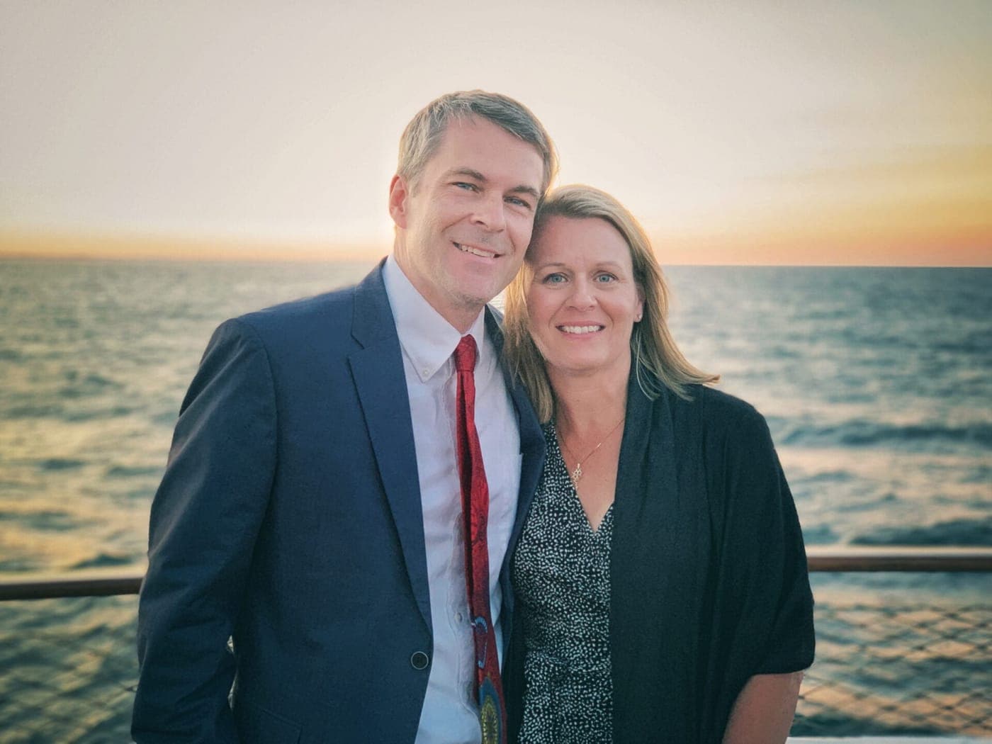 Karl and Julie Johnson on deck at sunset.